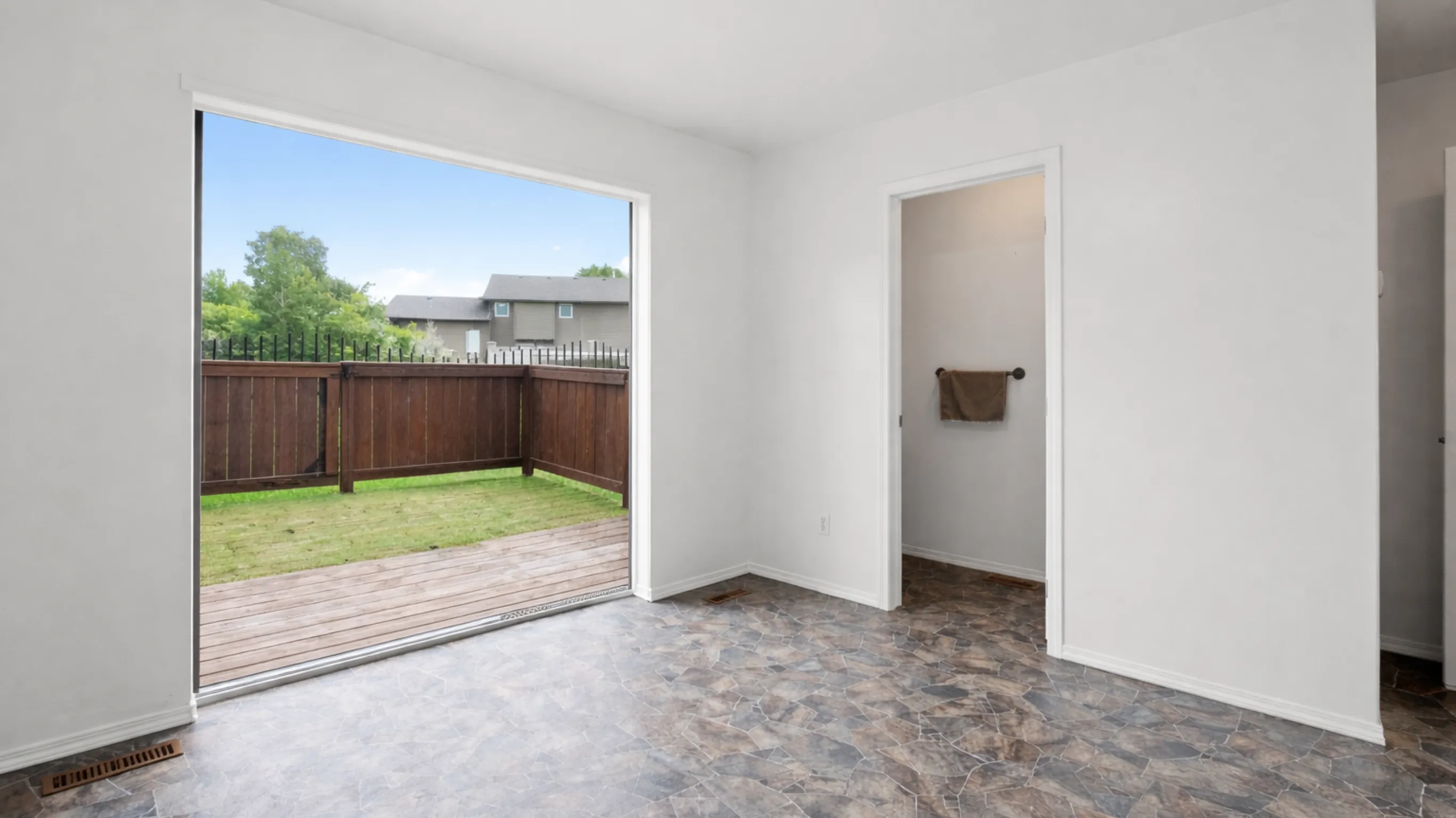 Standard sliding glass door with curtains in a Los Angeles home before being upgraded to a panoramic seamless system by Dream Patios LA.