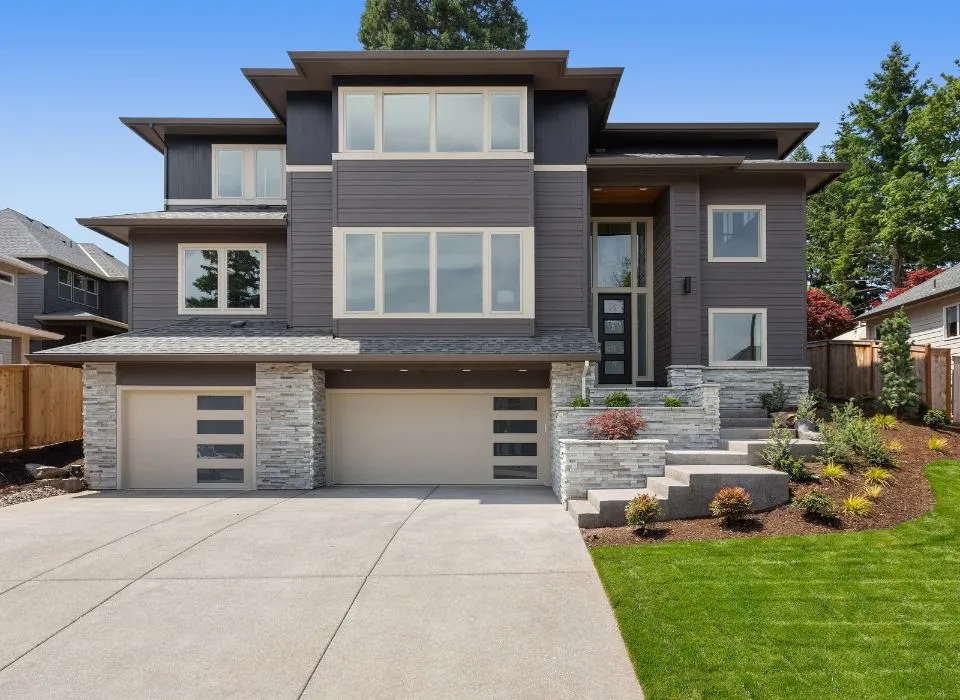 High-end hardscape front yard makeover featuring a coordinated driveway and porch design in Los Angeles by Dream Patios LA.